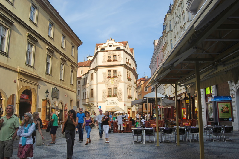 22 - Karlova Street in the historic Old Town of Prague, Czech Republic, featuring the iconic historic building known as the House at the Golden Well